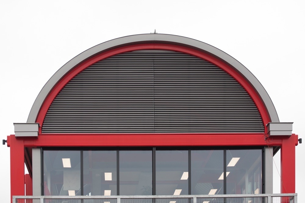 commercial aluminium louvres on semi-circle building graphic